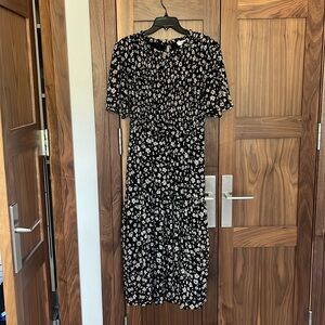This is an Orange Creek dress bought from a boutique called “Twirl”